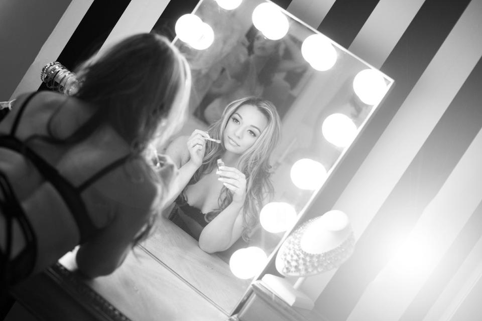 amptons boudoir photographer Ina McConnell — woman in glamour pose with vanity mirror, Long Island NY